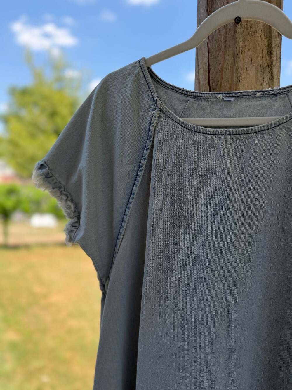 Umgee Women's Light Wash Denim High-Low Tunic Dress with Frayed Hem and Pockets - Picture 2 of 6